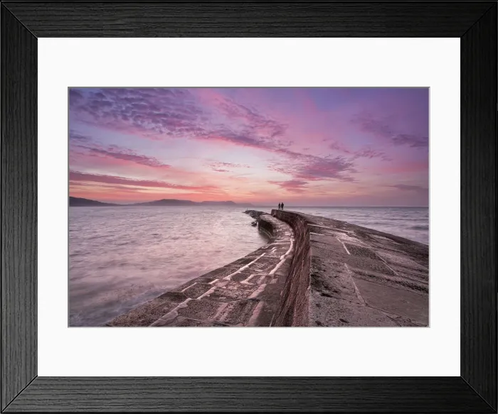 Framed Print : Couple standing on The Cobb at sunrise, Lyme Regis, Dorset, England Framed Print : Couple standing on The Cobb at sunrise, Lyme Regis, Dorset, England