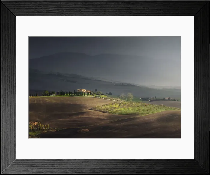 Framed Print : sunlight during a rain storm on a farmhouse Val d Orcia Tuscany, Italy