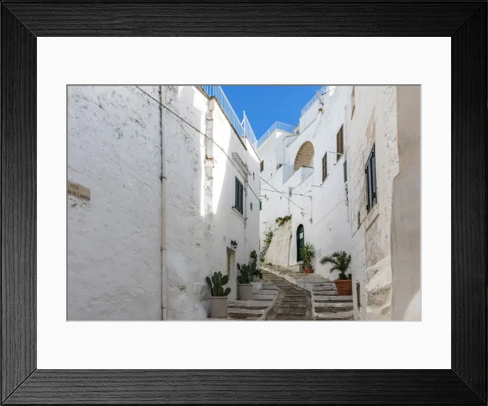 Framed Print : europe, Italy, Apulia. Ostuni, the white facades of the houses in the historic center Framed Print : europe, Italy, Apulia. Ostuni, the white facades of the houses in the historic center