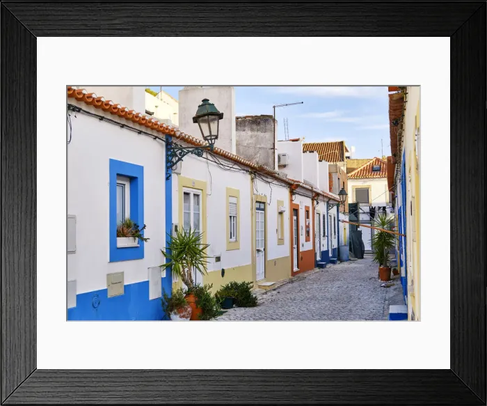Framed Print : Street of the traditional fishing village of Alcochete, spreading along the river Tagus Framed Print : Street of the traditional fishing village of Alcochete, spreading along the river Tagus