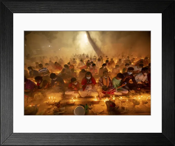 Framed Print : Devotees attend prayer with burning incense and light oil lamps before break fasting Framed Print : Devotees attend prayer with burning incense and light oil lamps before break fasting