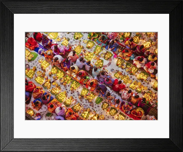 Framed Print : Devotees attend prayer with burning incense and light oil lamps before break fasting Framed Print : Devotees attend prayer with burning incense and light oil lamps before break fasting