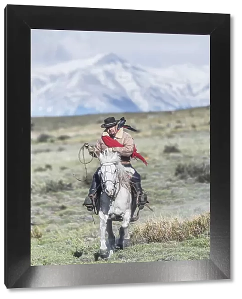 Cowboy on horseback, Torres del Paine National Park, Chile, MR
