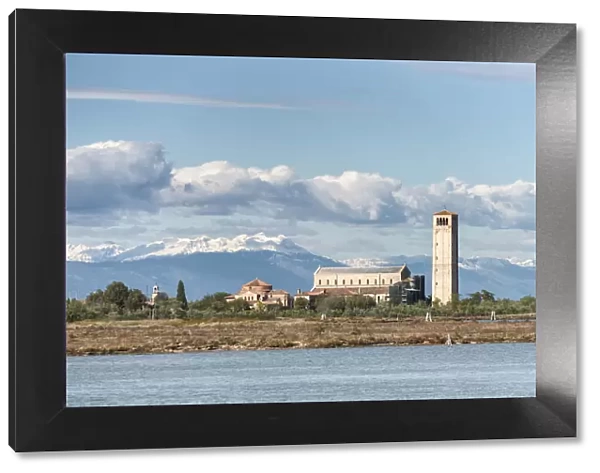 Church and bell tower of Torcello island and snowy Alps in background, Torcello island