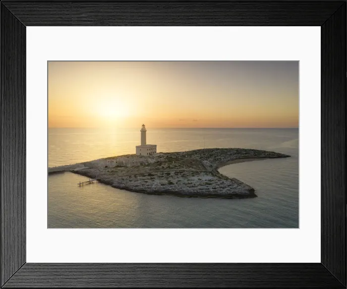 Framed Print : Vieste lighthouse, during a warm summer sunrise, municipality of Vieste, Foggia province Framed Print : Vieste lighthouse, during a warm summer sunrise, municipality of Vieste, Foggia province