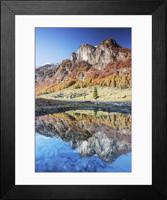 Framed Print : Village of Corte Terza and mountains is reflected in a clear puddle in autumn Framed Print : Village of Corte Terza and mountains is reflected in a clear puddle in autumn