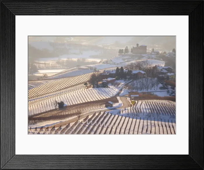 Framed Print : View of the road to the castle of Grinzane Cavour in winter after a snowfall Framed Print : View of the road to the castle of Grinzane Cavour in winter after a snowfall