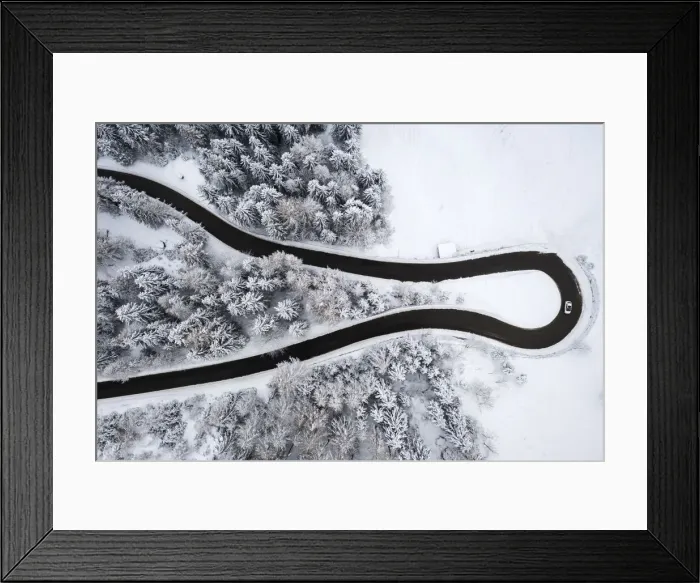 Framed Print : Aerial view of the winding road of the Presolana Pass after a winter snowfall Framed Print : Aerial view of the winding road of the Presolana Pass after a winter snowfall