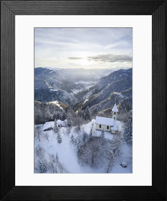 Framed Print : Aerial view of the Silvestri church and the Scalve valley after a winter sunrise Framed Print : Aerial view of the Silvestri church and the Scalve valley after a winter sunrise