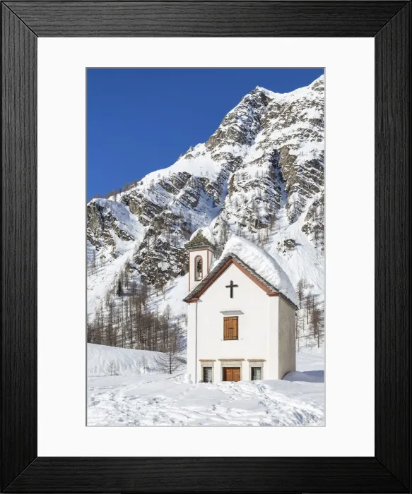 Framed Print : View of the mountain church of the small town of Crampiolo in winter Framed Print : View of the mountain church of the small town of Crampiolo in winter