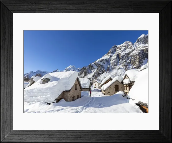 Framed Print : View of mountain huts and the church of the small town of Crampiolo in winter Framed Print : View of mountain huts and the church of the small town of Crampiolo in winter