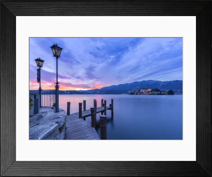 Framed Print : Sunset near a pier in front of San Giulio island and Lake Orta Framed Print : Sunset near a pier in front of San Giulio island and Lake Orta