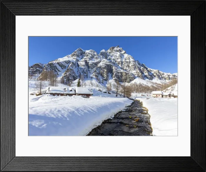 Framed Print : View of mountain huts near the torrent Devero in the small town of Crampiolo in winter