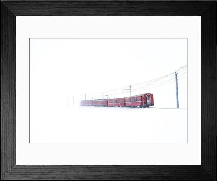 Framed Print : Bernina Express during a snowfall at Bernina Pass, Graubunden, Engadine, Switzerland Framed Print : Bernina Express during a snowfall at Bernina Pass, Graubunden, Engadine, Switzerland