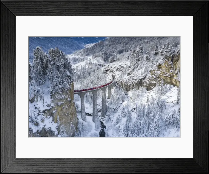 Framed Print : Bernina Express train on Landwasser viaduct in a snowy winter, Filisur Framed Print : Bernina Express train on Landwasser viaduct in a snowy winter, Filisur
