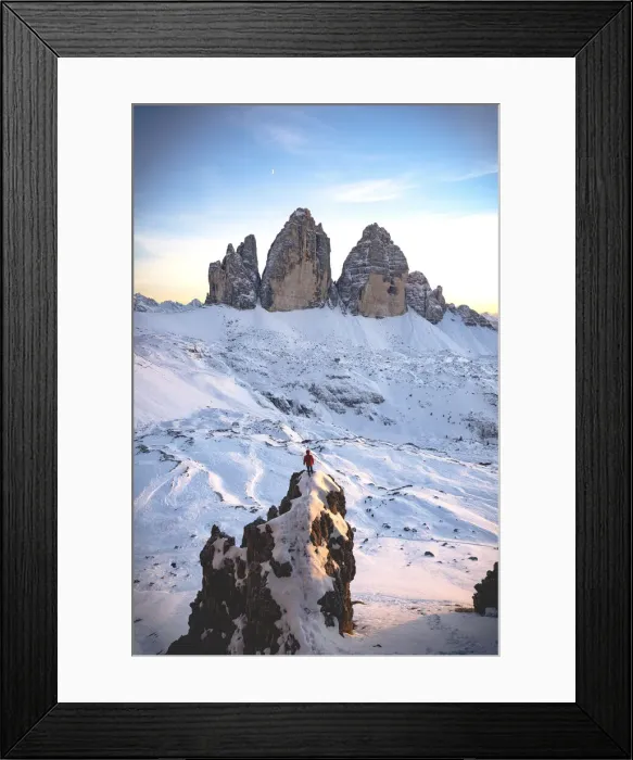 Framed Print : Hiker man on rocks admiring sunset over Tre Cime di Lavaredo surrounded by snow Framed Print : Hiker man on rocks admiring sunset over Tre Cime di Lavaredo surrounded by snow