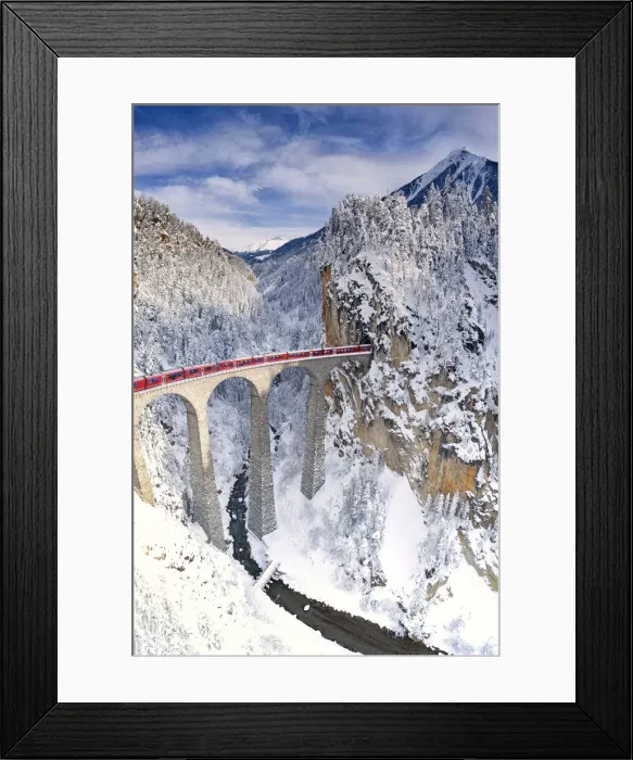 Framed Print : Bernina Express train on Landwasser viaduct during the snowy winter, Filisur Framed Print : Bernina Express train on Landwasser viaduct during the snowy winter, Filisur