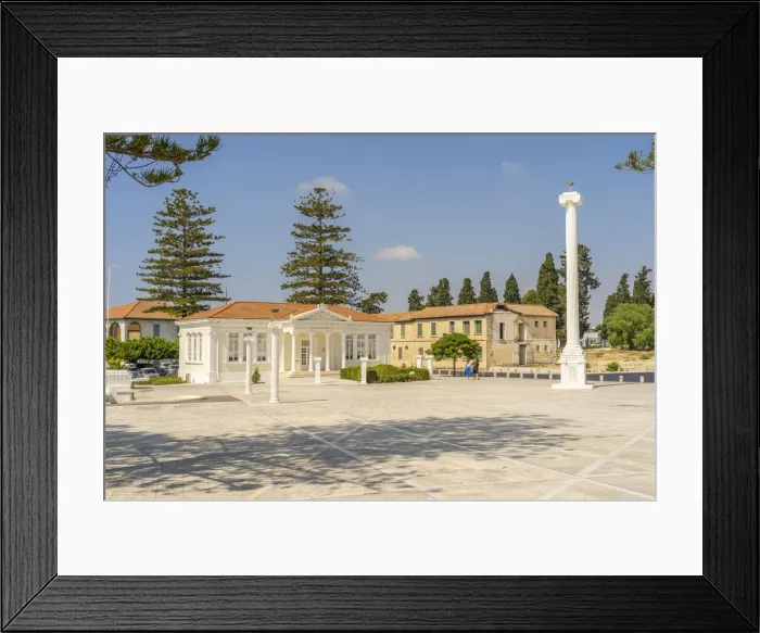 Framed Print : 28th of October Column and the Paphos Municipal Library in 28th of October Square, Paphos