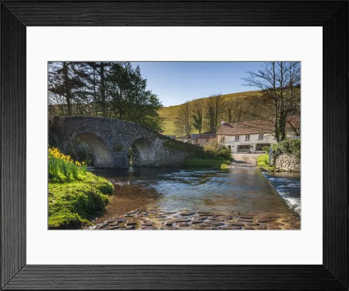 Framed Print : Stone bridge over Badgworthy Water in the picture postcard village of Malmsmead Framed Print : Stone bridge over Badgworthy Water in the picture postcard village of Malmsmead