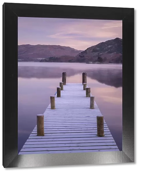 Wooden jetty on Ullswater at dawn on a frosty winter morning, Lake District, Cumbria