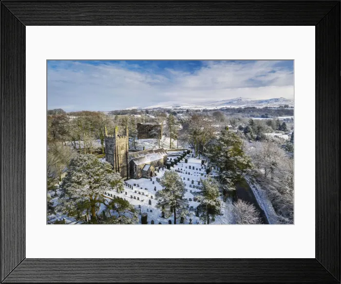 Framed Print : Aerial vista of St Petrocs Church and Lydford Castle on a snowy winter morning in Framed Print : Aerial vista of St Petrocs Church and Lydford Castle on a snowy winter morning in