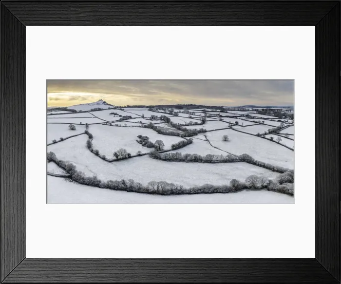 Framed Print : Dawn sky over snow covered countryside near Brentor Church, Devon, England Framed Print : Dawn sky over snow covered countryside near Brentor Church, Devon, England
