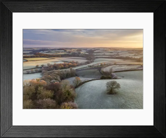 Framed Print : Rolling countryside at dawn on a frosty winter morning, Devon, England Framed Print : Rolling countryside at dawn on a frosty winter morning, Devon, England