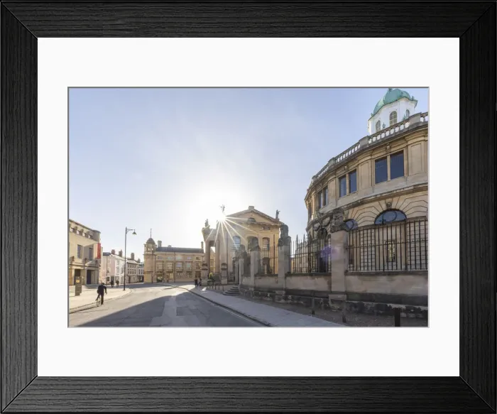 Framed Print : Cyclist beside the Sheldonian Theatre, Oxford, Oxfordshire, England, UK Framed Print : Cyclist beside the Sheldonian Theatre, Oxford, Oxfordshire, England, UK