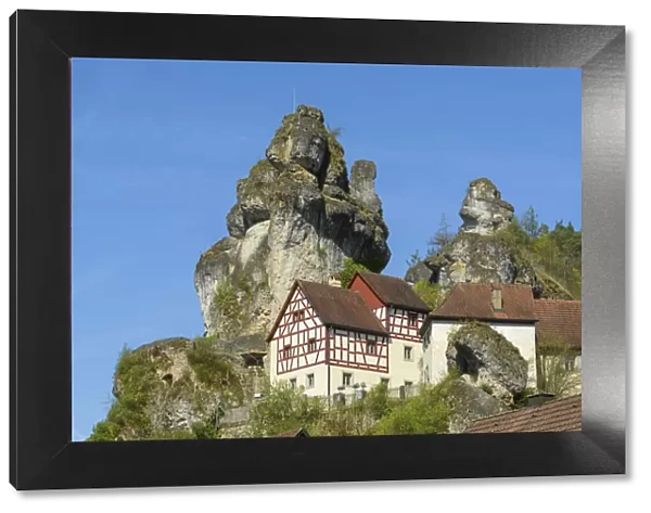 Rocks and half-timbered houses, TAochersfeld, Franconian Switzerland, Bavaria