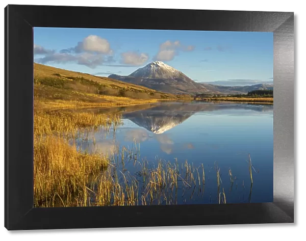 Ireland, Co. Donegal, Snow capped Errigal mountain reflected in Clady river