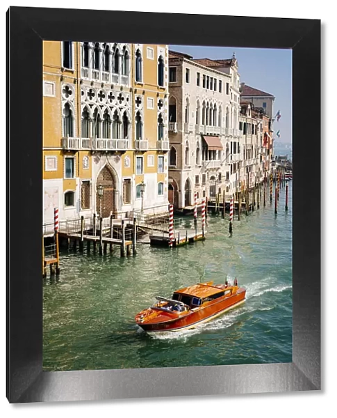 Iconic wooden motorboat, Grand Canal, Venice, Veneto, Italy