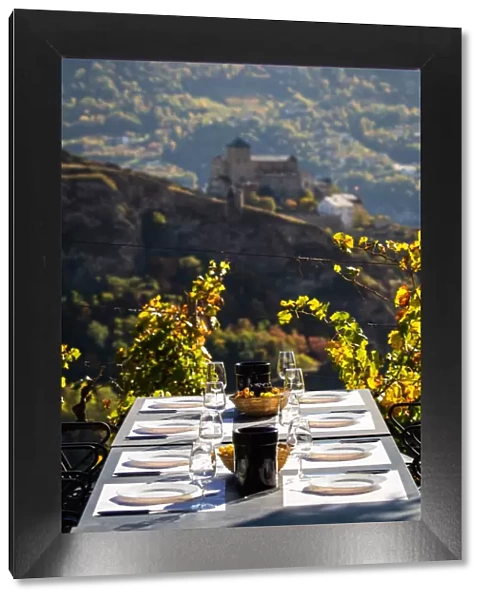 Switzerland, Canton of Valais, Sion, Table set for wine tasting on the Bisse de Clavau