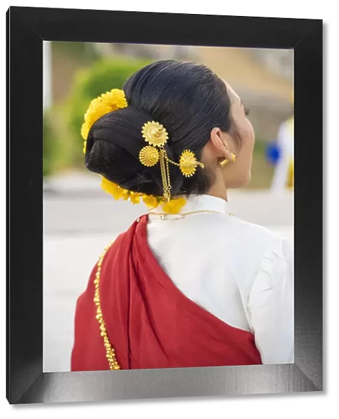 Thailand, Lampang, Wat Phrathat Lampang Luang, rear view of womans traditional costume