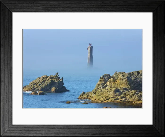 Framed Print : Rocky coast at Pointe de Pern with lighthouse of Nividic in fog - France, Brittany Framed Print : Rocky coast at Pointe de Pern with lighthouse of Nividic in fog - France, Brittany