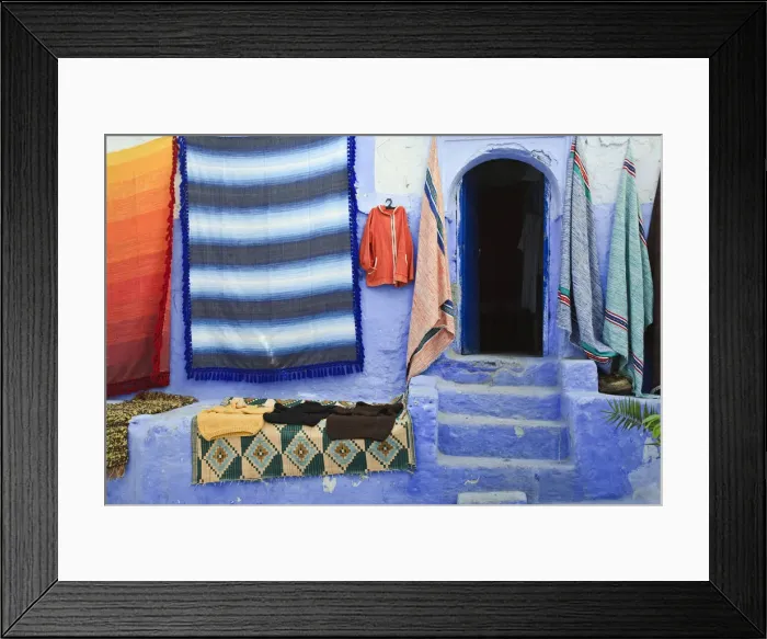 Framed Print : Blue doorway and traditional Moroccan fabrics, Chefchaouen, Morocco Framed Print : Blue doorway and traditional Moroccan fabrics, Chefchaouen, Morocco