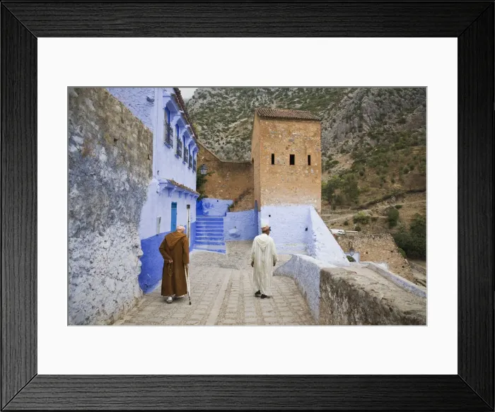 Framed Print : Two Men walking on the edge of the medina in Chefchaouen, Morocco Framed Print : Two Men walking on the edge of the medina in Chefchaouen, Morocco