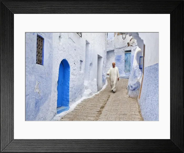 Framed Print : Man in traditional Moroccan clothing walking in the streets of Chefchaouen, Morocco