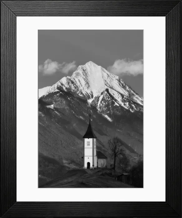 Framed Print : Church of St Primoz with snow capped peak of Storzic in the Kamnik-savinja Alps, Jamnik