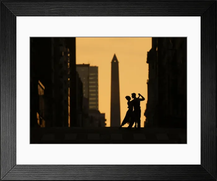 Framed Print : A couple of Professional Tango dancers on Avenida Corrientes at sunset, with the Obelisk monument in the background. Buenos Aires, Argentina. (MR) Framed Print : A couple of Professional Tango dancers on Avenida Corrientes at sunset, with the Obelisk monument in the background. Buenos Aires, Argentina. (MR)