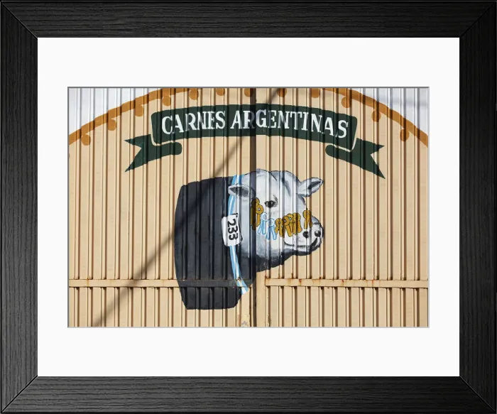 Framed Print : A wall art of an Argentine cow painted on the door of a building in Puerto Iguazu, Misiones, Argentina Framed Print : A wall art of an Argentine cow painted on the door of a building in Puerto Iguazu, Misiones, Argentina