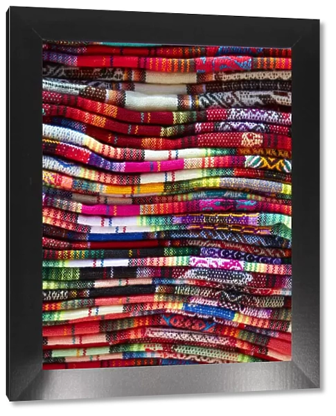 A detail of the vibrant colors of northern Argentinian textiles from a street stand of