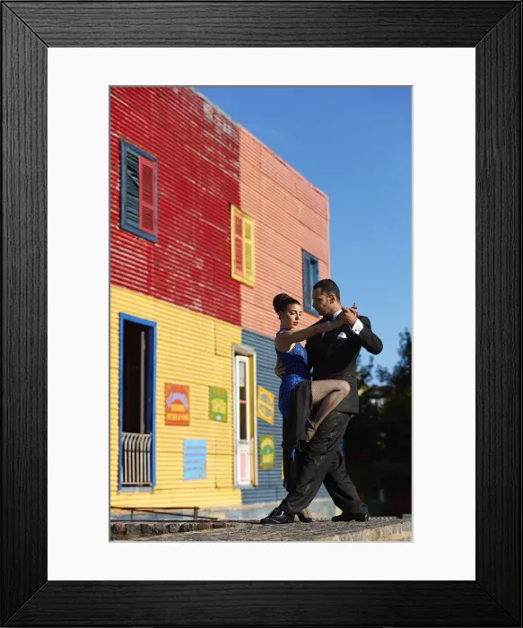 Framed Print : A couple of Professional Tango dancers with a colorful house of La Boca neighborhood in the background, Buenos Aires, Argentina. (MR) Framed Print : A couple of Professional Tango dancers with a colorful house of La Boca neighborhood in the background, Buenos Aires, Argentina. (MR)