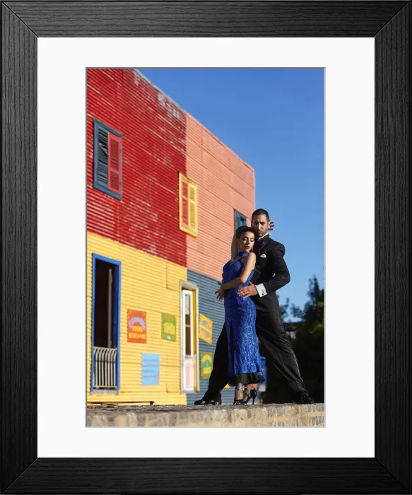 Framed Print : A couple of Professional Tango dancers with a colorful house of La Boca neighborhood in the background, Buenos Aires, Argentina. (MR) Framed Print : A couple of Professional Tango dancers with a colorful house of La Boca neighborhood in the background, Buenos Aires, Argentina. (MR)
