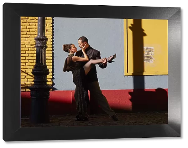 A couple of Professional Tango dancers in the colorful 'Caminito de la Boca', Buenos Aires, Argentina. (MR)