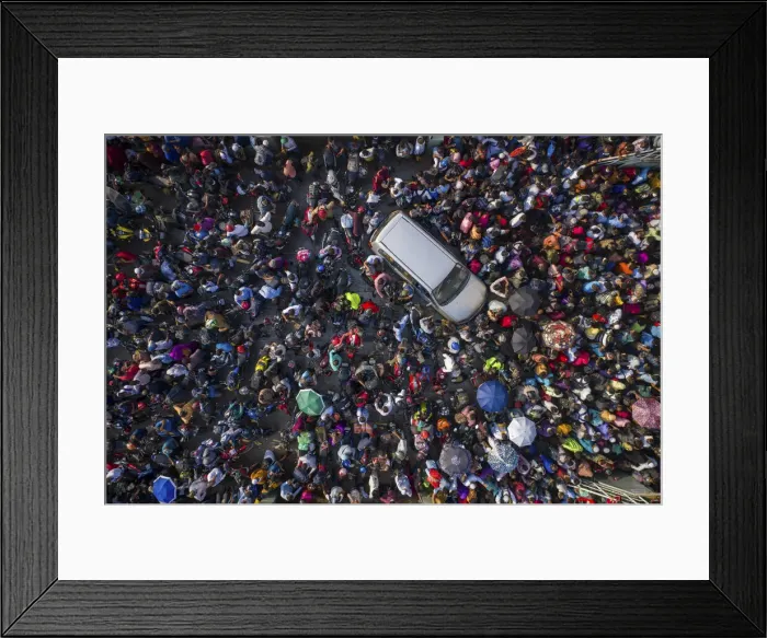 Framed Print : Aerial view of millions of people rush to board a ferry with their belongings to get home Framed Print : Aerial view of millions of people rush to board a ferry with their belongings to get home