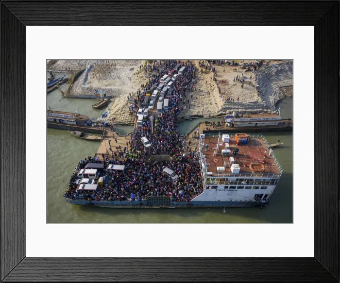 Framed Print : Aerial view of millions of people rush to board a ferry with their belongings to get home