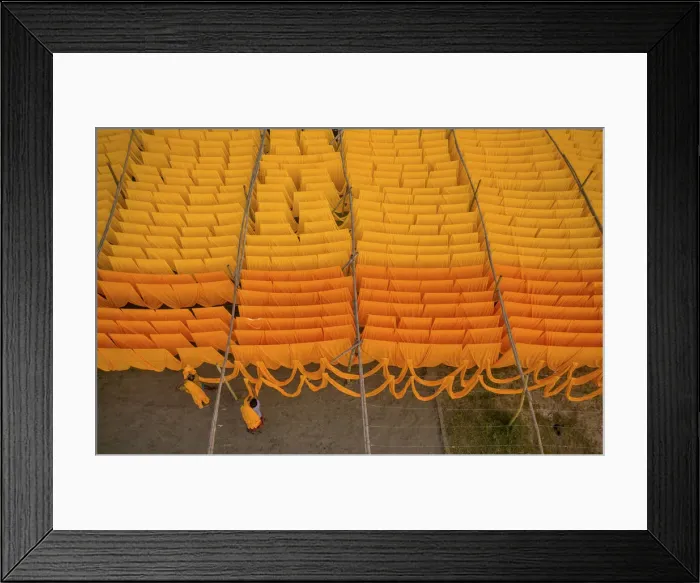 Framed Print : Workers hang thousands of metres of different coloured t-shirt fabrics to dry in Framed Print : Workers hang thousands of metres of different coloured t-shirt fabrics to dry in