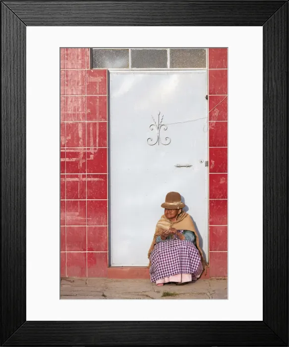 Framed Print : Elder woman sitted in front of a door in Copacabana, Lake Titicaca, La Paz, Bolivia Framed Print : Elder woman sitted in front of a door in Copacabana, Lake Titicaca, La Paz, Bolivia