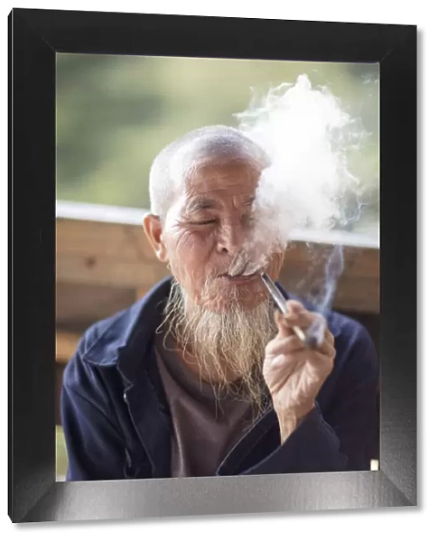 Old man smoking pipe, Longji, Longshen, Guangxi, China