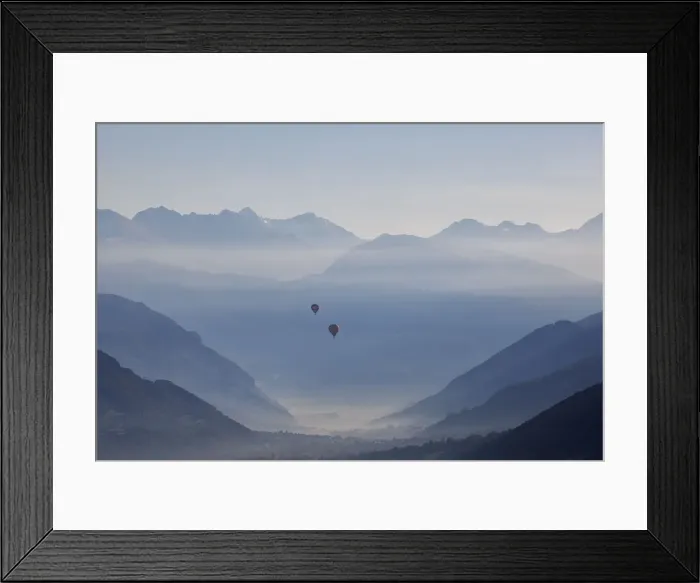 Framed Print : Two hot air balloons fly over the city of Aosta, Aosta province Framed Print : Two hot air balloons fly over the city of Aosta, Aosta province